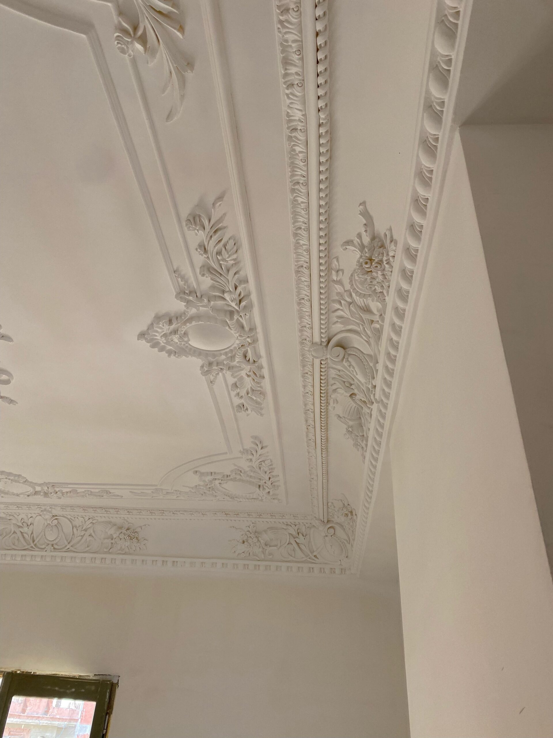 More crown molding & ceiling art.