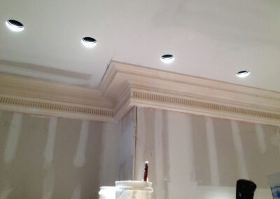 Crown molding with several layers and simple patterns creates clean lines and a sophisticated look.